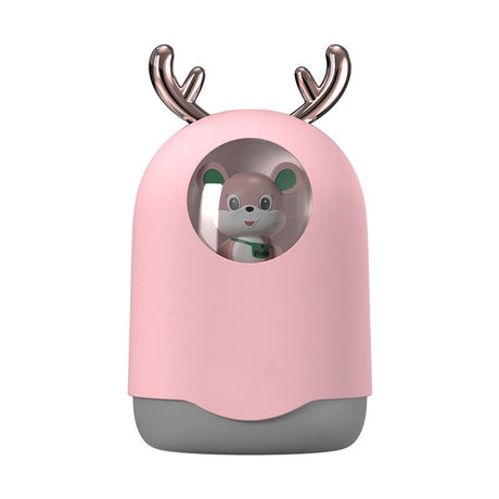 Pink toy with deer antlers featuring a small bear inside on a white background