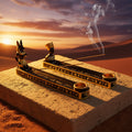 Decorative incense holder with Egyptian-themed design on a white background