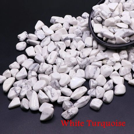 White turquoise stones with a bowl on a dark background