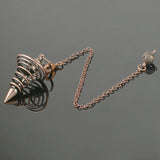 Bronze-colored necklace with a spike design on a dark gray background
