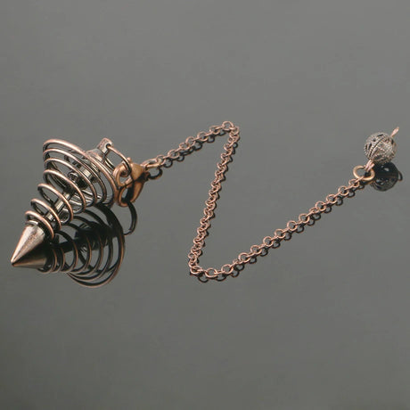 Bronze-colored necklace with a spike design on a dark gray background
