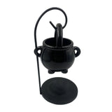 Black cauldron with a lid on a white background