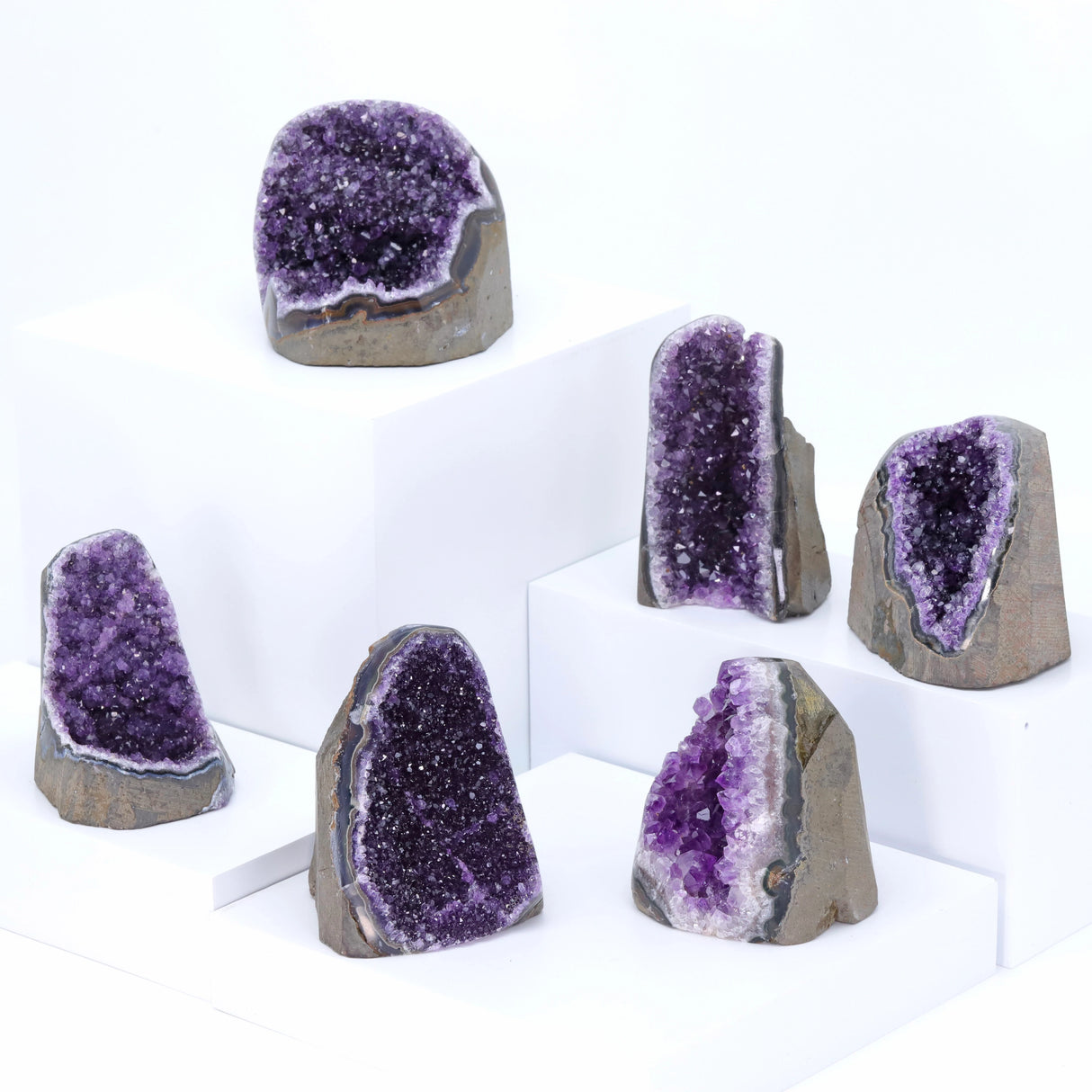 Set of amethyst geodes on a white background