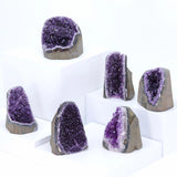 Set of amethyst geodes on a white background