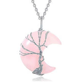 Pink crescent moon and silver tree branch pendant on a white background