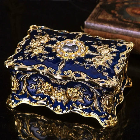 Decorative blue and gold box with intricate designs on a dark background