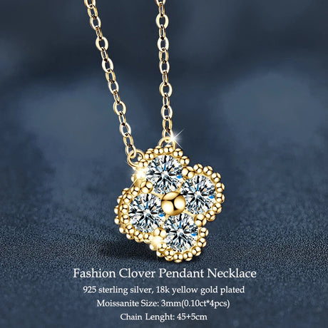 Gold necklace with a clover pendant on a dark background