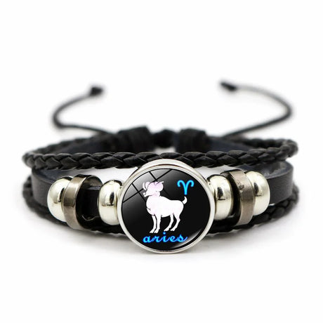 Black braided bracelet with Aries zodiac sign charm on a white background