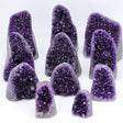 Collection of purple crystal geodes on a white background
