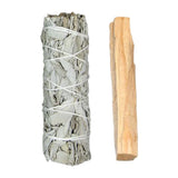 White sage smudge stick and wooden tool on a white background