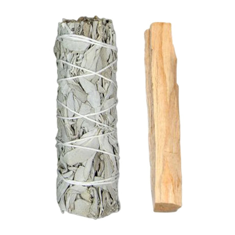 White sage smudge stick and wooden tool on a white background