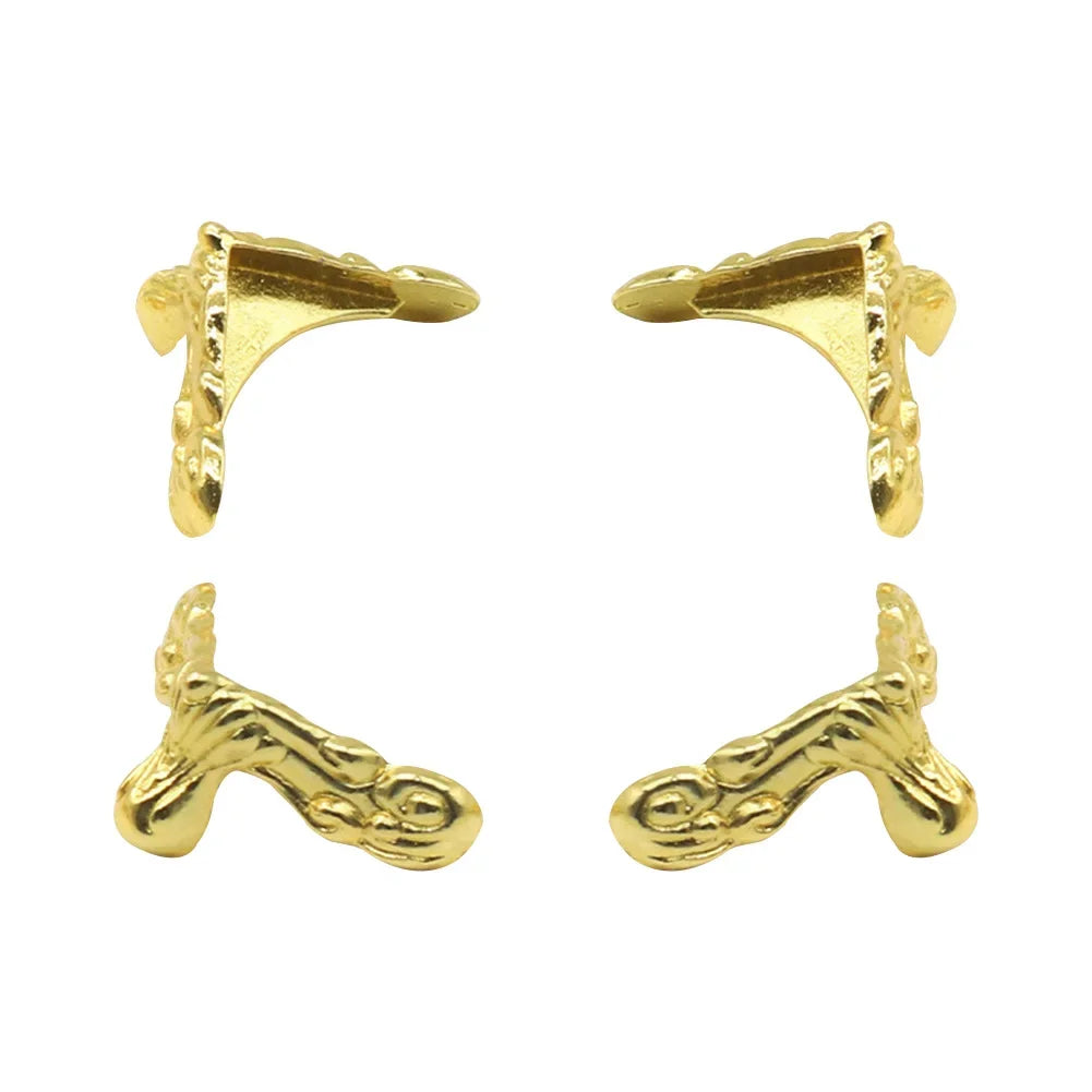 Gold earring clips on a white background