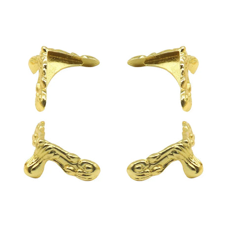 Gold earring clips on a white background