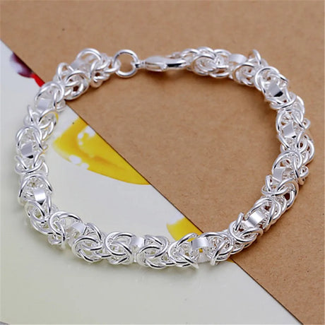 Silver bracelet on a textured surface