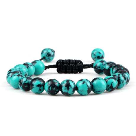 Turquoise and black beaded bracelet on a white background