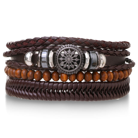 Set of leather and wooden bracelets with metal accents on a white background
