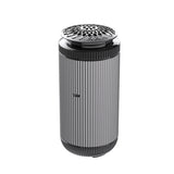 Cylindrical air purifier with a decorative top on a white background