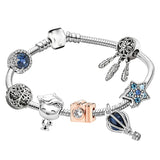 Bracelet with various charms on a white background