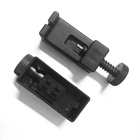 Two black camera accessories on a white background