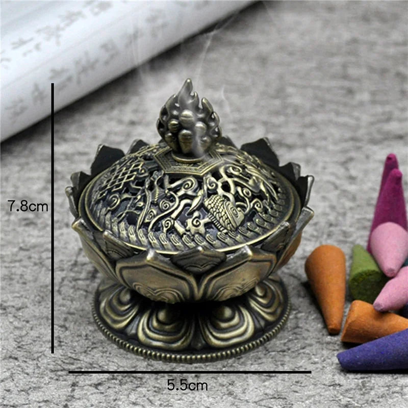 Decorative incense burner with intricate designs on a textured surface with colorful sticks.