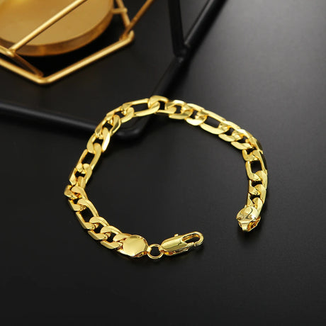Gold chain bracelet on a black background