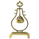 Bronze incense burner with decorative top on a white background
