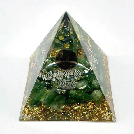 Pyramid-shaped object with green and gold elements on a white background