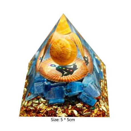 Pyramid-shaped object with blue crystals and a central disc featuring a cat silhouette on a white background