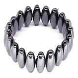 Silver coil bracelet on a white background
