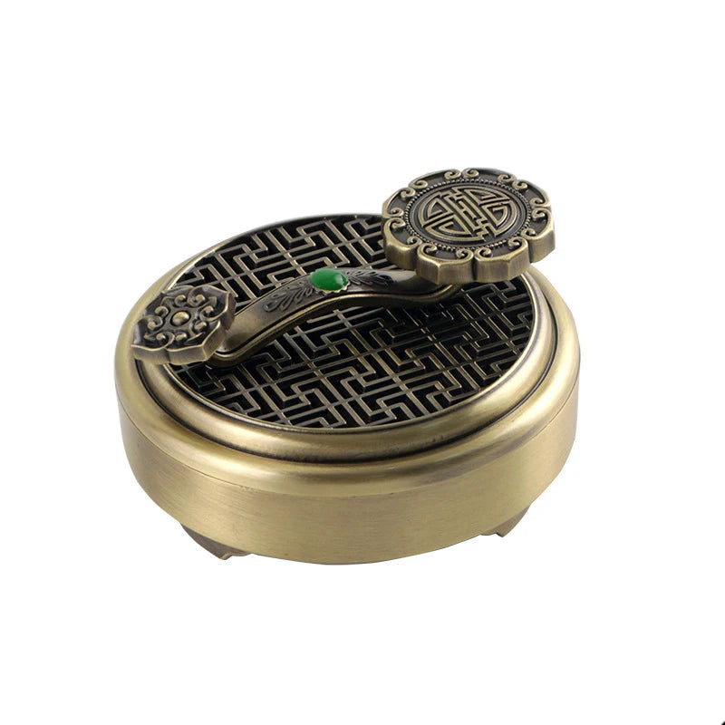 Bronze incense burner with intricate design on a white background