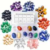 Assorted tumbled crystals in a clear container with labels on a white background