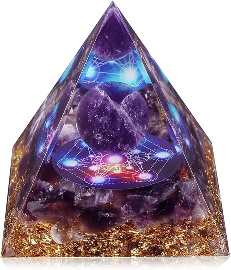 Pyramid-shaped crystal with amethyst stones and energy diagram on a white background