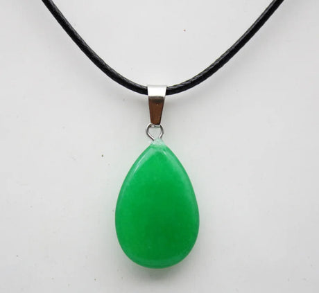 Green teardrop pendant on a black cord against a white background