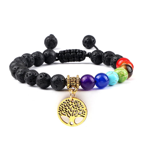 Black beaded bracelet with a gold tree of life charm on a white background