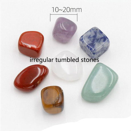 Collection of irregular tumbled stones on a white background with text indicating size and description.