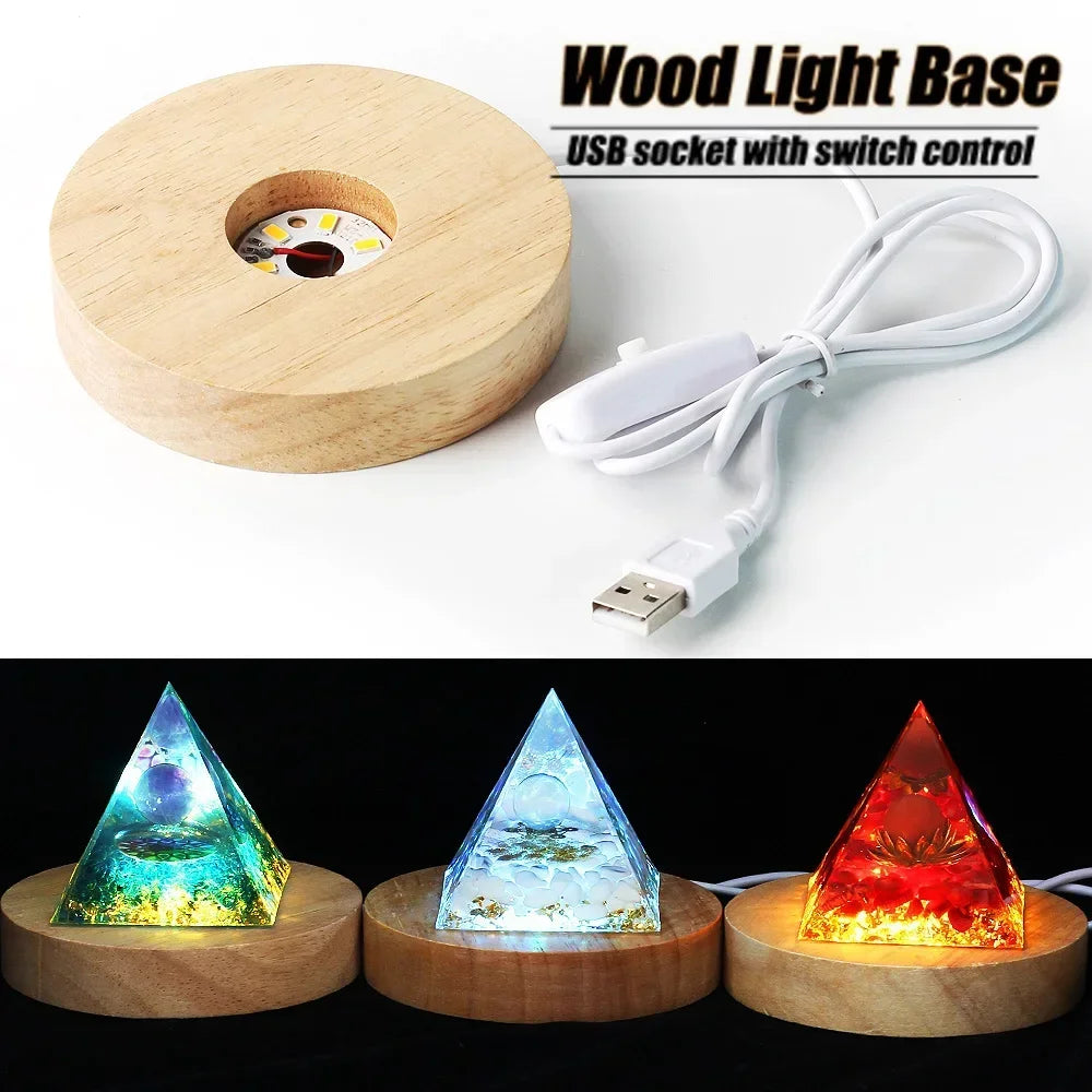 Wooden light base with USB cable and three pyramid-shaped lights on a white background