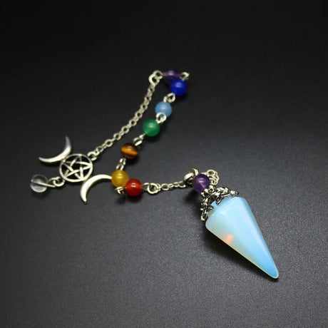 Necklace with a blue pendant and colorful beads on a dark background