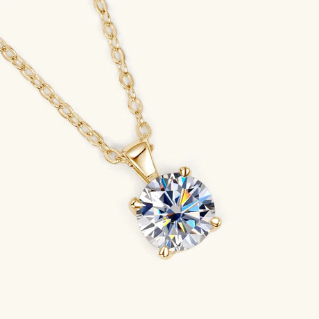Gold necklace with a diamond pendant on a white background
