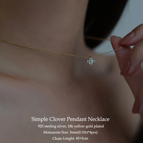Simple Clover Pendant Necklace with gold chain and clover pendant, worn by a person.