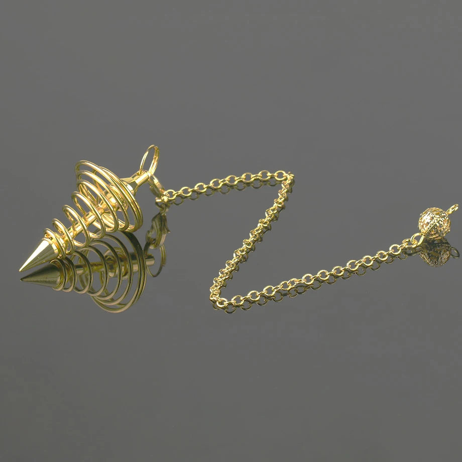 Gold spiral pendant on a chain against a dark background