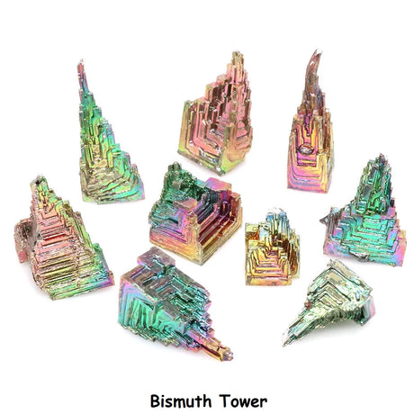 Collection of iridescent bismuth crystal towers on a white background