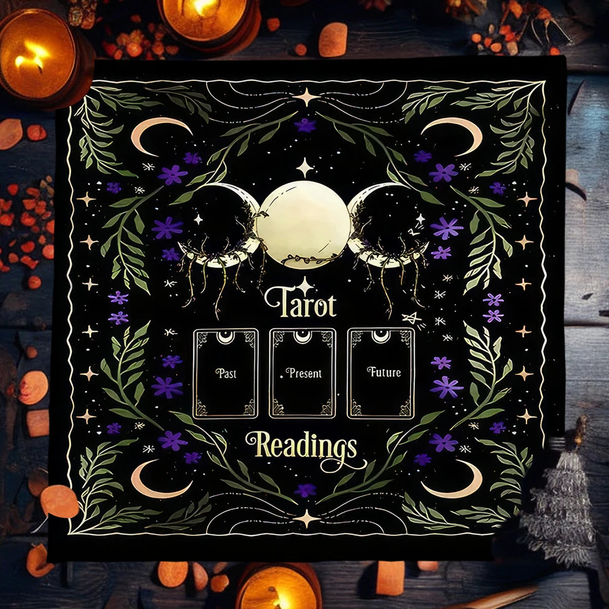 Decorative mat with tarot card design and candles on a wooden surface