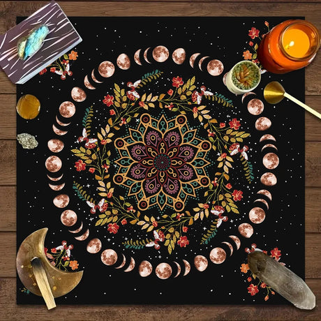 Decorative mat with mandala design, moon phases, and celestial elements on a wooden surface.