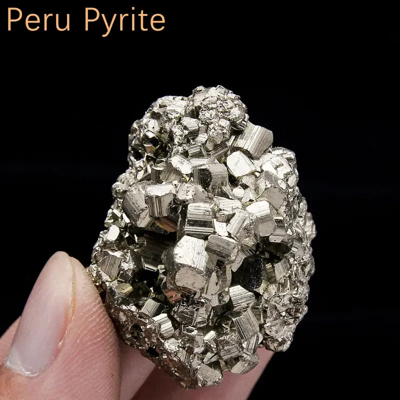 Peru Pyrite crystal held in hand with a black background