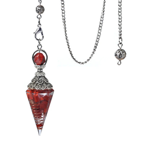 Necklace with a red pendant and silver chain on a white background