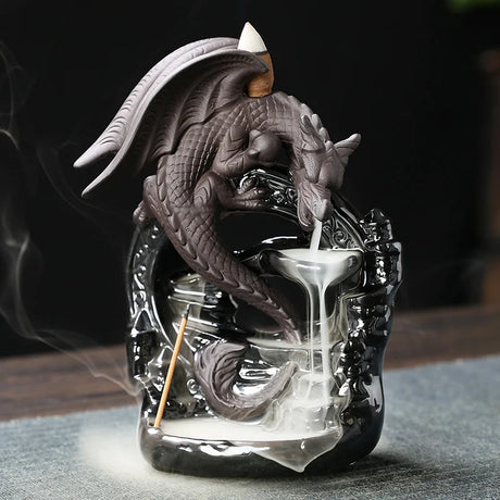 Dragon-shaped incense burner with incense sticks on a dark background