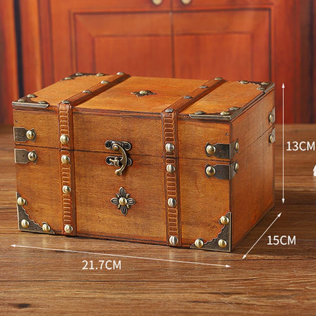 Wooden treasure chest with decorative elements on a wooden surface, showing measurements.