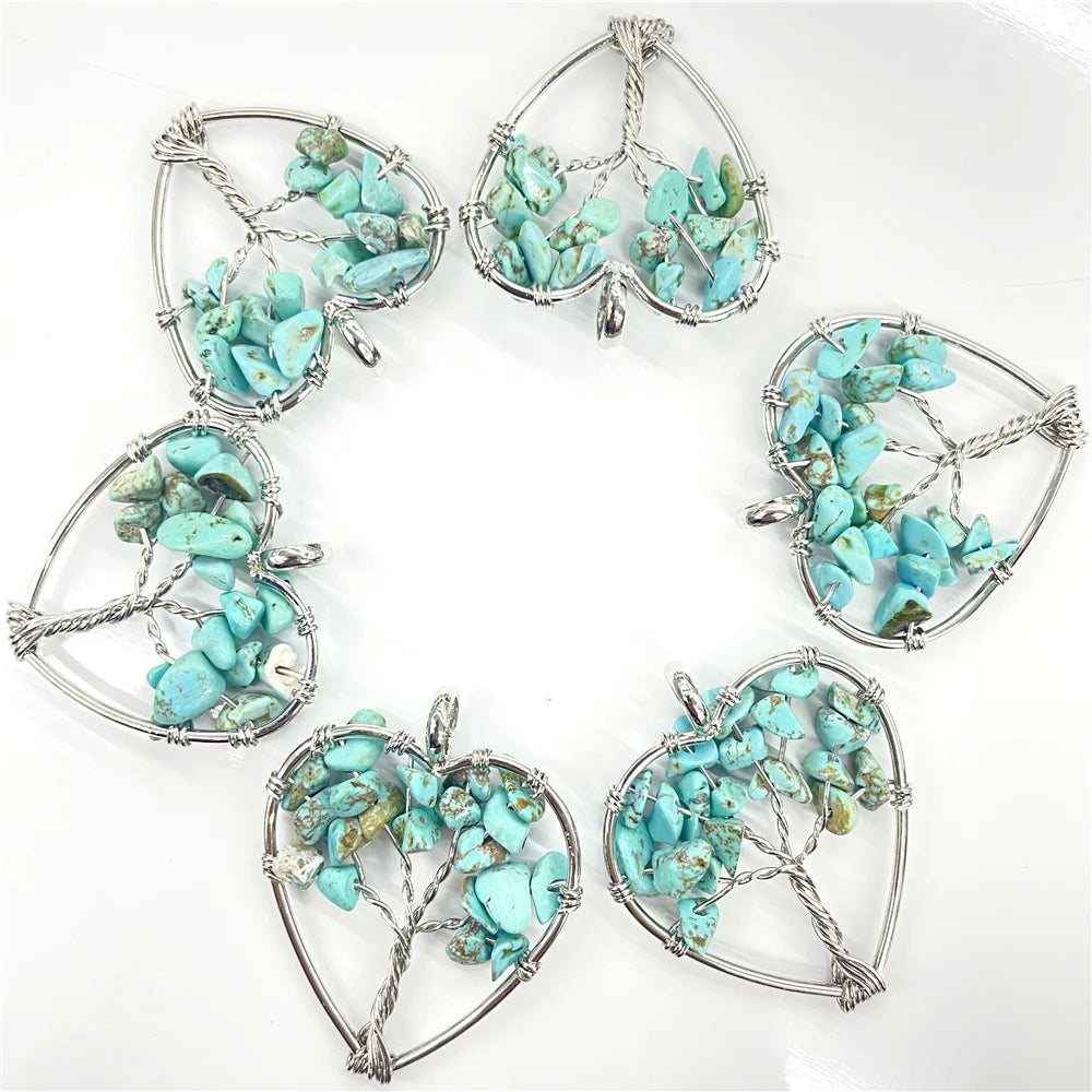 Set of turquoise stone pendants in silver frames on a white background