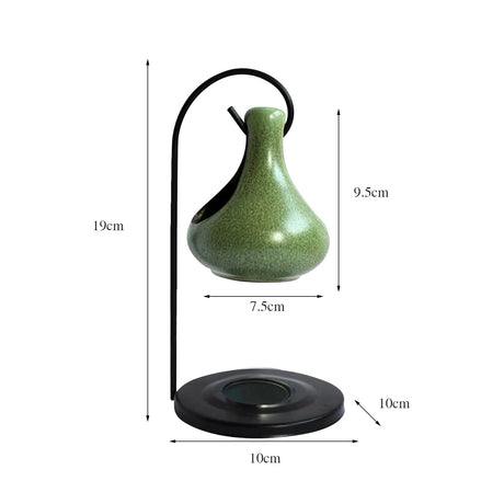Green vase with black stand and measurements on a white background