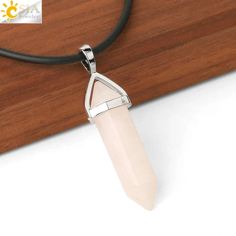 Necklace with a beige pendant on a wooden surface